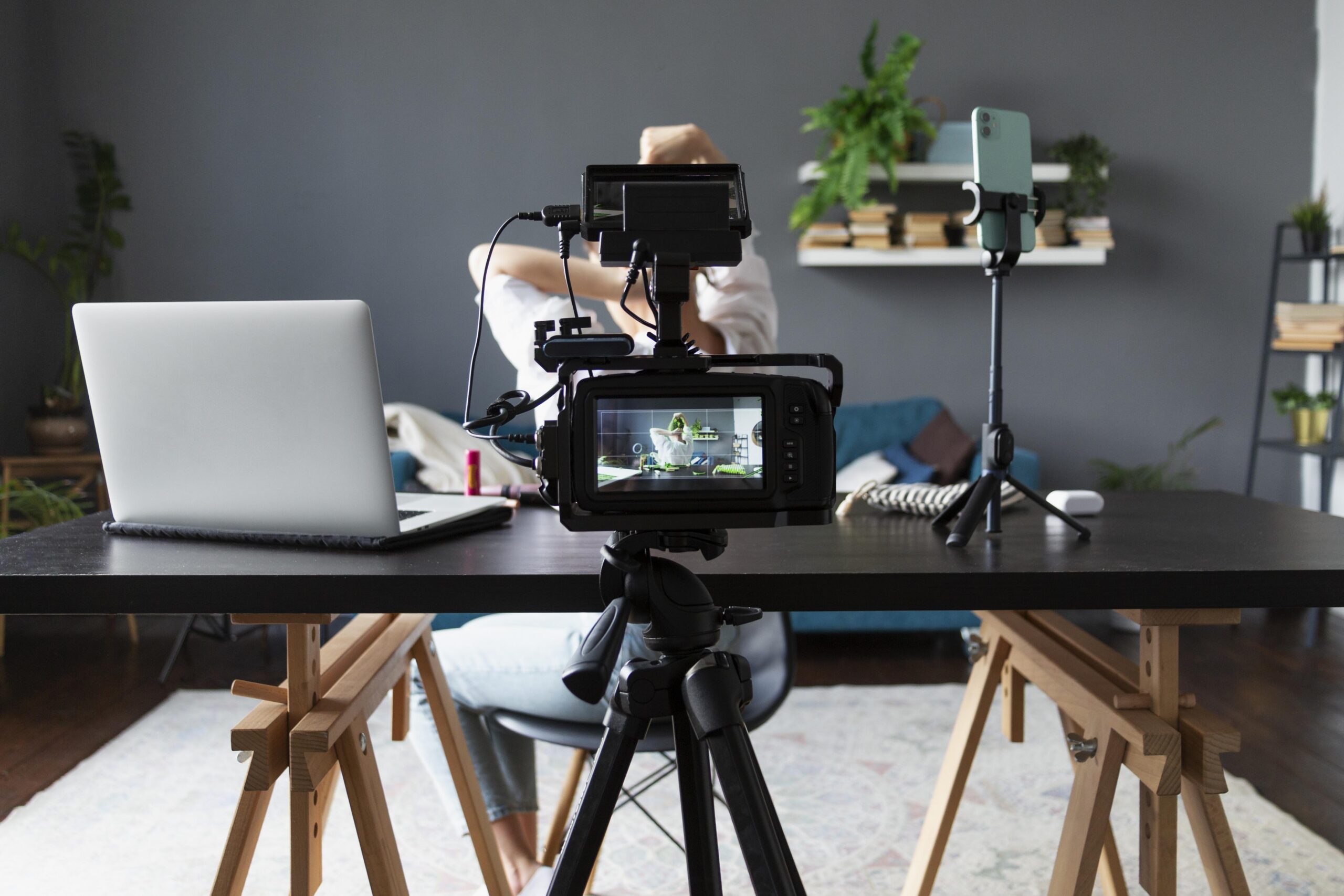 Woman making beauty vlog with her professional camera